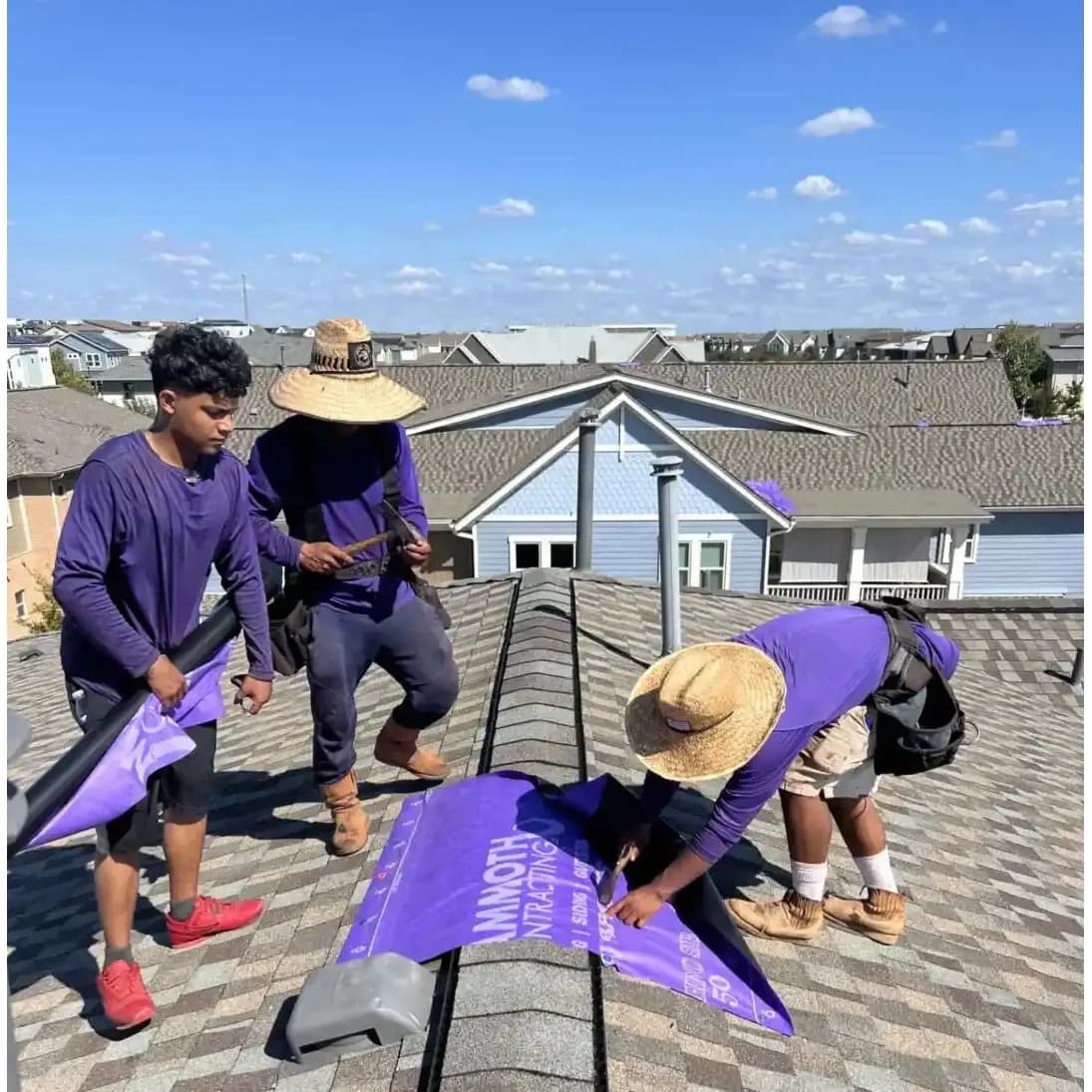 Mammoth roofers placing protective sheeting on a roof