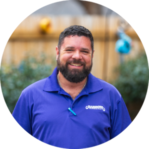 Nicholas Domenech - Roofing Specialist at Mammoth Roofing & Solar, wearing a purple polo, smiling in an outdoor setting.