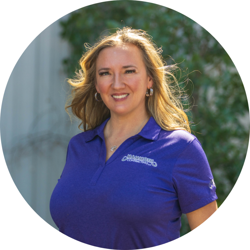 Danielle, a team leader at Mammoth Roofing & Solar, wearing a company-branded polo, representing excellence in roofing and solar solutions.