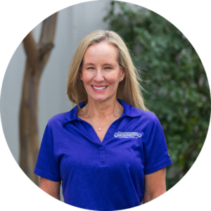 Sarah Johnson, team member at Mammoth Roofing & Solar, wearing a company polo shirt and smiling outdoors.
